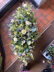 White, Purple and Green Casket Spray